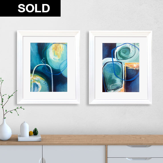 Set of two framed original paintings titled Mossy River Banks by soulcurryart, depicting tranquil riverbank landscapes.